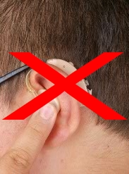 Red X Marked Over Old Hearing Aid