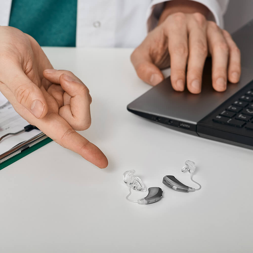 Audiologist Advising Patient on Hearing Aids